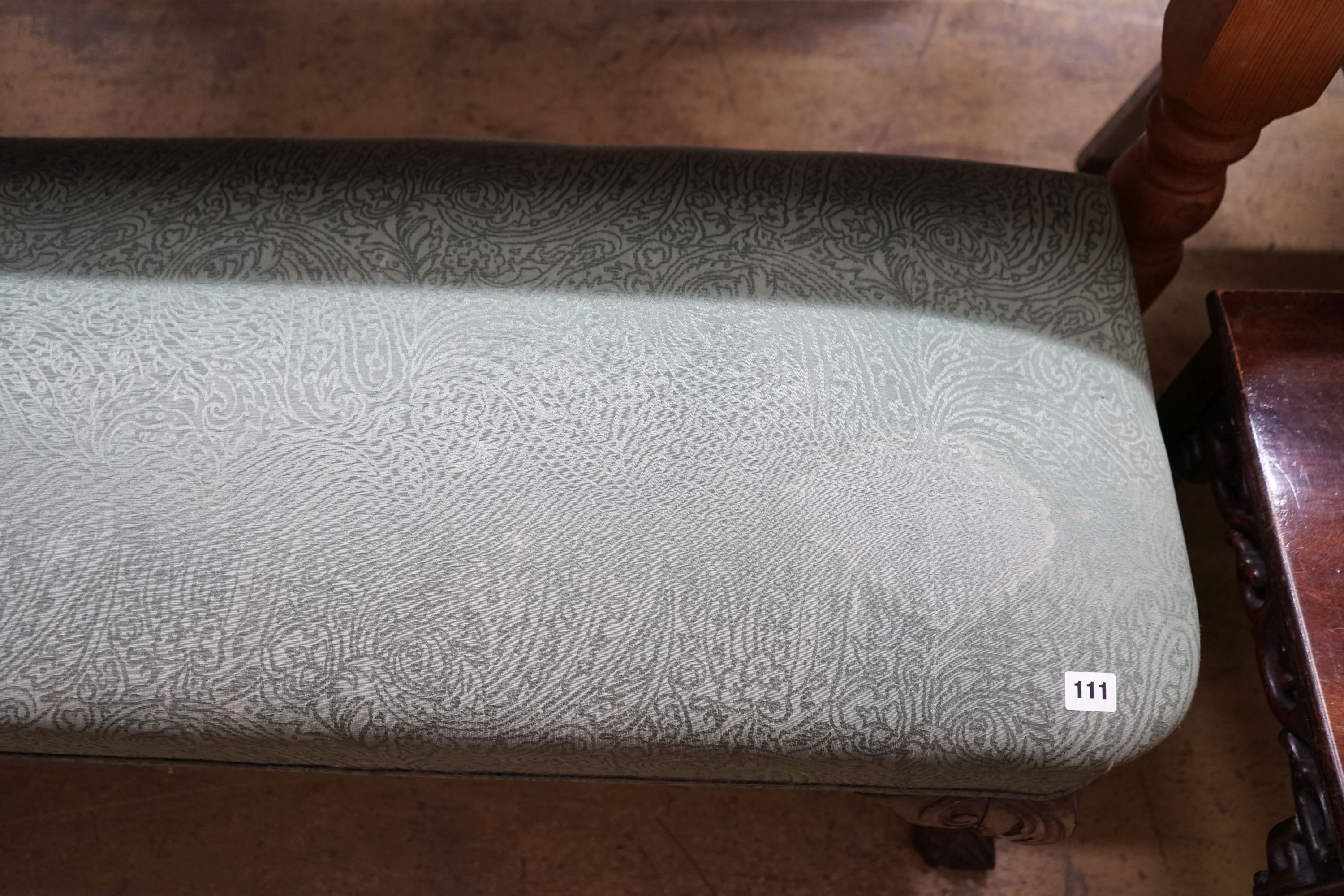 A George II style upholstered window seat on carved cabriole legs, length 168cm, depth 46cm, height 48cm